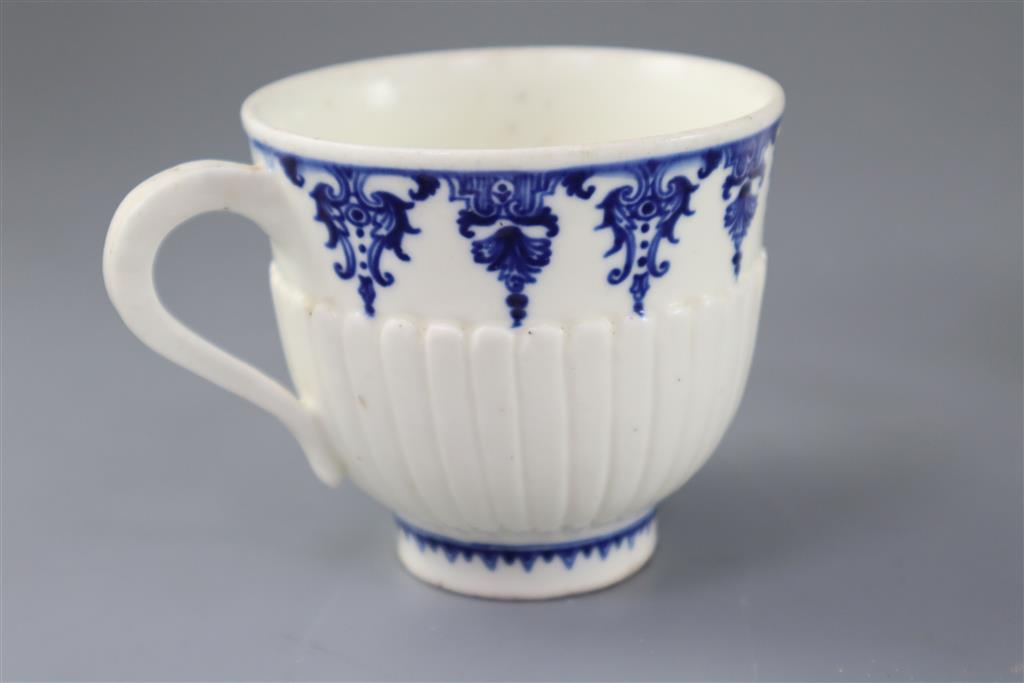 A St. Cloud cup and trembleuse saucer, c.1725-1740 and a Chantilly custard cup and cover, c.1750, (4)